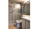 Cozy bathroom featuring a glass-enclosed shower, white toilet, and a matching vanity at 1313 S Pine Ridge Cir # C1, Sanford, FL 32773