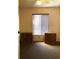 Bedroom featuring neutral walls, a window, and matching bedside storage cabinets at 1313 S Pine Ridge Cir # C1, Sanford, FL 32773
