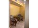 Dining area featuring a glass-topped table set and ceramic tile flooring with painted yellow walls at 1313 S Pine Ridge Cir # C1, Sanford, FL 32773