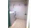 Compact laundry room with washer, dryer, and wire shelving at 1313 S Pine Ridge Cir # C1, Sanford, FL 32773