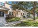 Townhouse exterior showcasing front porch and landscaping at 15407 Blackbead St, Winter Garden, FL 34787