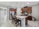 Modern kitchen with island and dark wood cabinets at 15407 Blackbead St, Winter Garden, FL 34787