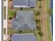 An overhead perspective capturing the home and its proximity to a tranquil pond at 16737 Meadows St, Clermont, FL 34714