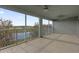 Spacious screened balcony offering serene views of the water at 16737 Meadows St, Clermont, FL 34714