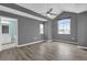 Spacious bedroom featuring tall, vaulted ceilings and grey flooring at 16737 Meadows St, Clermont, FL 34714