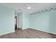 Bedroom featuring grey wood-look floors with a ceiling fan at 16737 Meadows St, Clermont, FL 34714