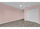 Bedroom with grey toned flooring and a double door closet at 16737 Meadows St, Clermont, FL 34714