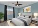 Charming bedroom featuring a plush bed, modern décor, and a bright window at 16737 Meadows St, Clermont, FL 34714