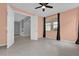 Bedroom with tile flooring, ceiling fan, and modern design, offering a comfortable and stylish living space at 16737 Meadows St, Clermont, FL 34714