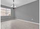 Dining room with tile flooring, chandelier, and large window creates a comfortable space for meals at 16737 Meadows St, Clermont, FL 34714