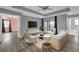 Bright living room boasts modern furniture, ceiling fan, and access to a balcony at 16737 Meadows St, Clermont, FL 34714