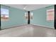 Bright living room with large windows and tile flooring provides an airy feel and plenty of natural light at 16737 Meadows St, Clermont, FL 34714