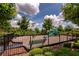 Fun-filled community playground, perfect for , featuring slides, spring riders and a safety-conscious fenced area at 16737 Meadows St, Clermont, FL 34714