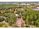 An aerial view of the community playground surrounded by mature trees and landscaping at 16737 Meadows St, Clermont, FL 34714
