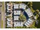 Aerial view of modern townhouses near a lake at 1762 Mondrian Cir, Winter Park, FL 32789