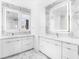 Elegant double vanity bathroom with marble accents at 1762 Mondrian Cir, Winter Park, FL 32789