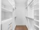 Bright, spacious closet with custom shelving and rods at 1762 Mondrian Cir, Winter Park, FL 32789