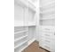 Large closet with shelves and hanging rods at 1762 Mondrian Cir, Winter Park, FL 32789