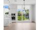 Modern kitchen with white cabinets, marble countertops and island at 1762 Mondrian Cir, Winter Park, FL 32789