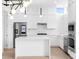 Modern white kitchen with stainless steel appliances at 1762 Mondrian Cir, Winter Park, FL 32789