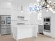 Modern white kitchen with stainless steel appliances at 1762 Mondrian Cir, Winter Park, FL 32789
