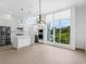 Modern kitchen with stainless steel appliances and large windows at 1762 Mondrian Cir, Winter Park, FL 32789