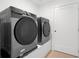 Laundry room with modern washer and dryer at 1762 Mondrian Cir, Winter Park, FL 32789