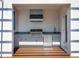 Modern outdoor kitchen with stainless steel appliances at 1762 Mondrian Cir, Winter Park, FL 32789