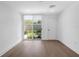 Bright room with sliding glass doors to a patio at 1762 Mondrian Cir, Winter Park, FL 32789