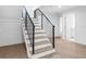 Modern staircase with sleek metal railing at 1762 Mondrian Cir, Winter Park, FL 32789