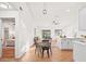 Modern kitchen with white shaker cabinets and an island at 214 Sharp St, Apopka, FL 32712