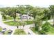 Aerial view of a charming house nestled on a tree-lined street at 219 Nob Hill Cir, Longwood, FL 32779