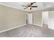 Spacious bedroom with ceiling fan and plush carpeting at 219 Nob Hill Cir, Longwood, FL 32779