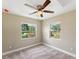 Well-lit bedroom with two windows and a ceiling fan at 219 Nob Hill Cir, Longwood, FL 32779