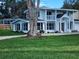 Two-story house with white exterior, landscaping, and a long driveway at 219 Nob Hill Cir, Longwood, FL 32779