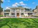 Two-story house with white exterior, landscaping, and a double-width driveway at 219 Nob Hill Cir, Longwood, FL 32779