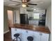 Eat-in kitchen with butcher block island and stainless steel appliances at 219 Nob Hill Cir, Longwood, FL 32779