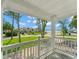 Charming porch view overlooking a waterfront neighborhood with lush landscaping at 219 Nob Hill Cir, Longwood, FL 32779