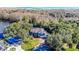 Stunning home on a sprawling, wooded lot with lush landscaping and a brick driveway near waterfront at 2395 Windward Cv, Kissimmee, FL 34746