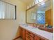 Bright bathroom with updated vanity and mirror at 2395 Windward Cv, Kissimmee, FL 34746