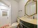 Updated bathroom with a modern vanity and decorative mirror at 2395 Windward Cv, Kissimmee, FL 34746