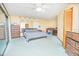 Primary bedroom with a king-size bed and access to a balcony at 2395 Windward Cv, Kissimmee, FL 34746