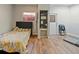 Small bedroom with a double bed and laminate wood floors at 2395 Windward Cv, Kissimmee, FL 34746