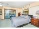 Spacious bedroom with a king-size bed and balcony access at 2395 Windward Cv, Kissimmee, FL 34746