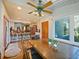 Dining area with wooden table and access to kitchen at 2395 Windward Cv, Kissimmee, FL 34746