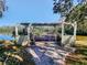 Wooden dock with pergola providing shade at 2395 Windward Cv, Kissimmee, FL 34746
