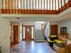Bright entryway with hardwood floors and staircase leading upstairs at 2395 Windward Cv, Kissimmee, FL 34746