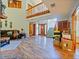 Two story living room with hardwood floors, fireplace and entryway view at 2395 Windward Cv, Kissimmee, FL 34746