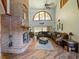 Spacious living room featuring a large brick fireplace and hardwood floors at 2395 Windward Cv, Kissimmee, FL 34746