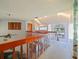 Open loft area with wood railing and natural light at 2395 Windward Cv, Kissimmee, FL 34746